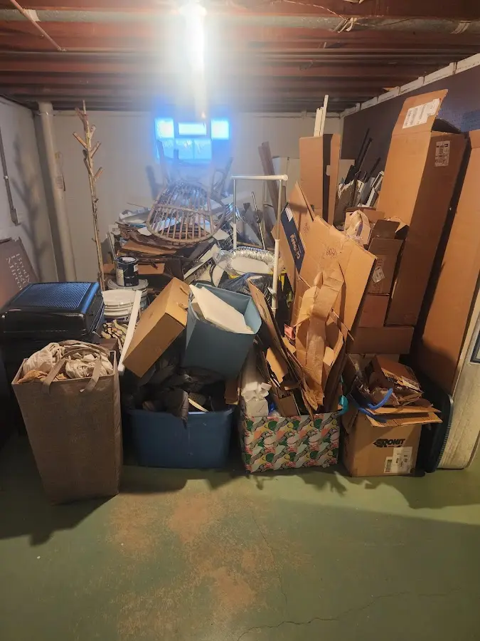 Roll-off dumpster container at job site for 2 Yard Dumpster Rental in Barbourville